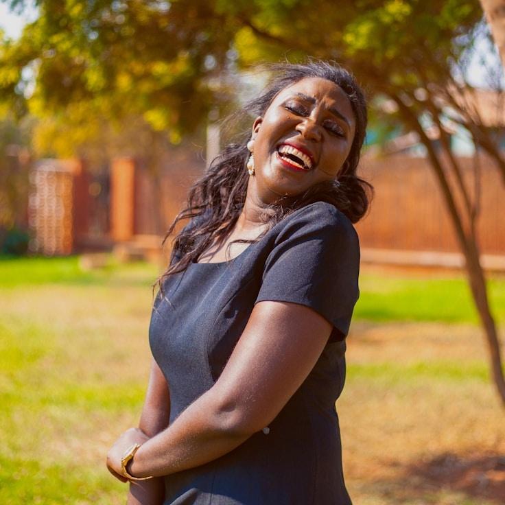 Kaveri Mehta, Lead Design Curator at OceanPulseCabin, reviewing corporate floral arrangements